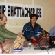 Sandip Bhattacharjee performing along with co-artists