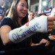 Cathey Park shows her bandaged hand written "I love Obamacare" as she waits to hear Barack Obama speak on healtcare at the Faneuil Hall in Boston, Massachusetts