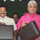 Union Minister for Railways D.V. Sadananda Gowda departs from Rail Bhavan to Parliament House along with the Minister of State for Railways, Manoj Sinha to present the Rail Budget 2014-15, in New Delhi on July 8