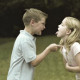 A boy and a girl fighting