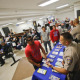 California Highway Patrol officers Armando Garcia, right, and Ray Patton explain to immigrants the process of getting a drivers license during an information session at the Mexican Consulate, in San Diego. California is gearing up to start issuing driver’s licenses to immigrants in the country illegally in a bid to make the roads safer that could also give more than a million people access to state-issued identification.