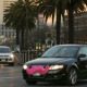 Lyft car drives crosses Market Street in San Francisco. California prosecutors have filed a lawsuit against Uber over the ridesharing company's background checks and other allegations, adding to the popular startup's worldwide legal woes.