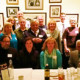 Some of the "Faith Forum" panelists, their spouses and others at a recent dinner celebrating the
completion of it 200th column
