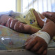 A boy affected by dengue fever rests at a hospital in Tegucigalpa, Honduras