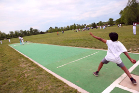 Aromal Kozhikal 9, of O'Fallon, Mo., bowls on the pitch during practice