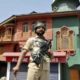 Srinagar: A security jawan, holding 'pellet gun', patrols on a deserted street during the 70th day of curfew in Srinagar on Friday. PTI Photo (PTI9_16_2016_000256A)