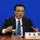 China's Premier Li Keqiang gestures as he speaks during a news conference, after the closing ceremony of the Chinese National People's Congress (NPC) at the Great Hall of the People, in Beijing March 13, 2014. REUTERS/Barry Huang (CHINA - Tags: POLITICS BUSINESS)