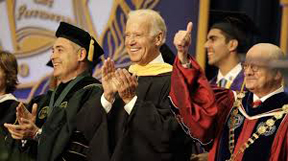 Vice President Joe Biden, center, smiles after arriving for a graduation ceremony at the Miami Dade College in Miami, Saturday, May 3