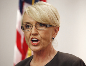 Arizona Republican Gov. Jan Brewer speaks at a news conference in Phoenix. A federal judge has struck down Arizona's 2005 immigrant smuggling law on the grounds that it's trumped by federal statutes.