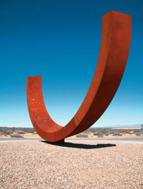 Newly installed sculpture at Spaceport America by artist Otto Rigan called GENESIS, arcs up to the sky. Glass embedded in the sculpture mirrors the summer sky over the spaceport. (Courtesy of New Mexico Spaceport Authority)