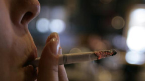 FILE - In this Tuesday, June 3, 2008 file photo, an employee smokes a cigarette at a bar and restaurant in Harrisburg, Pa. In a study released Wednesday, May 13, 2015, smokers with $150 of their own money at stake were far more likely to quit than smokers who didnÂ’t have to wager their money to get cash rewards. "A bit of a stick was much better than pure carrot," said the study's lead author, Dr. Scott Halpern of the University of Pennsylvania. But hereÂ’s the catch: Few people were willing to bet on themselves. Nearly everyone who was offered the rewards-only option, though, signed up for a stop smoking program. (AP Photo/Carolyn Kaster)