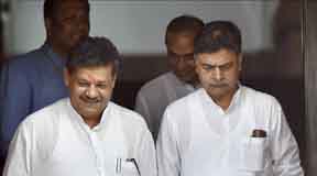 New Delhi: BJP MP R K Singh and MP Kirti Azad at Parliament house during the monsoon session in New Delhi on Friday. PTI Photo by Kamal Singh(PTI7_22_2016_000181A)