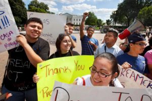 Young demonstrators participate in a rally in support of President Barack Obama after the president announced that the U.S. government will stop deporting and begin granting work permits to younger illegal immigrants