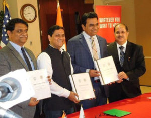 MoU signatories L to R Arvind Kumar, Hardik Bhatt with Minister KT Rama Rao and CG Dr Ausaf Sayeed