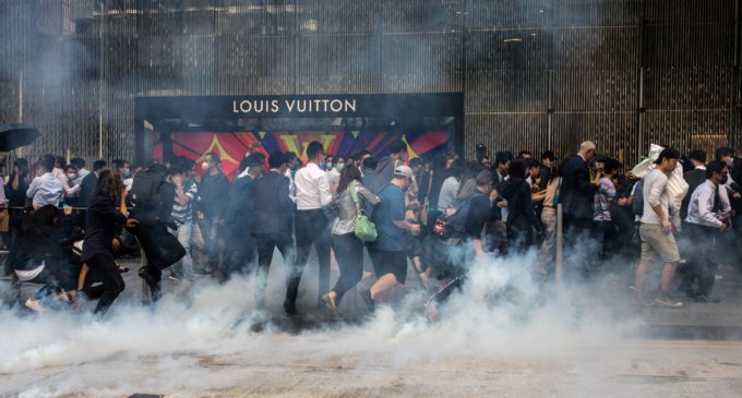 Police shoot protester, man set alight in day of Hong Kong fury
