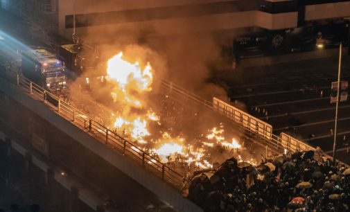 Protesters set fire to hold off police at Hong Kong campus