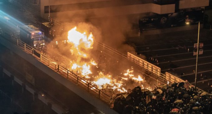 Protesters set fire to hold off police at Hong Kong campus