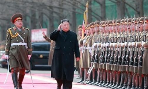 Trenchcoats and rockets: Kim supervises N Korea weapons test