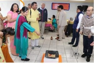 Devotees throw Roasted Channas in to ceremonial fire