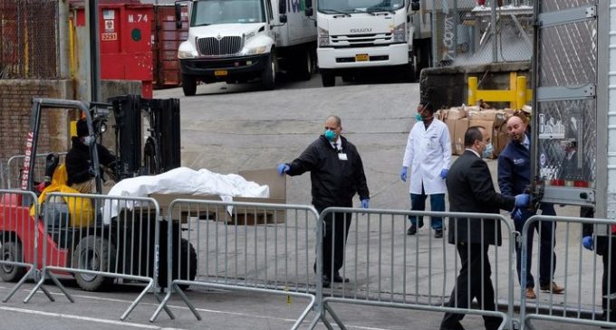 US toll at 3,899 passes grim 9/11 mark, prepares for worst