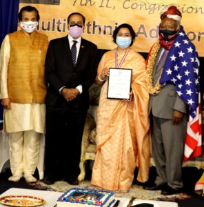 MAFS Chief Ms Santosh Kumar with Award presented to her by Rep Danny K Davis. Also seen in the pic are Dr Vijay Prabhakar and Rep. Raja Krishnmoorthy
