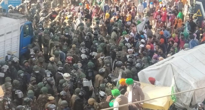 Farmers enter Delhi from Tikri border after braving water canons, clashing with policeĀ