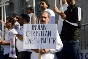 3. Madan Singh, holds a sign that says, "Indian Christian Lives Matter"